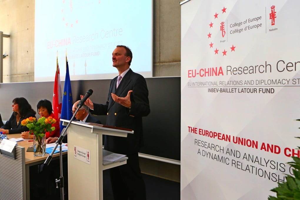 Jorg Monar, rector of the College of Europe, right, speaks at the opening of the EU-China Research Centre. Photo: Xinhua