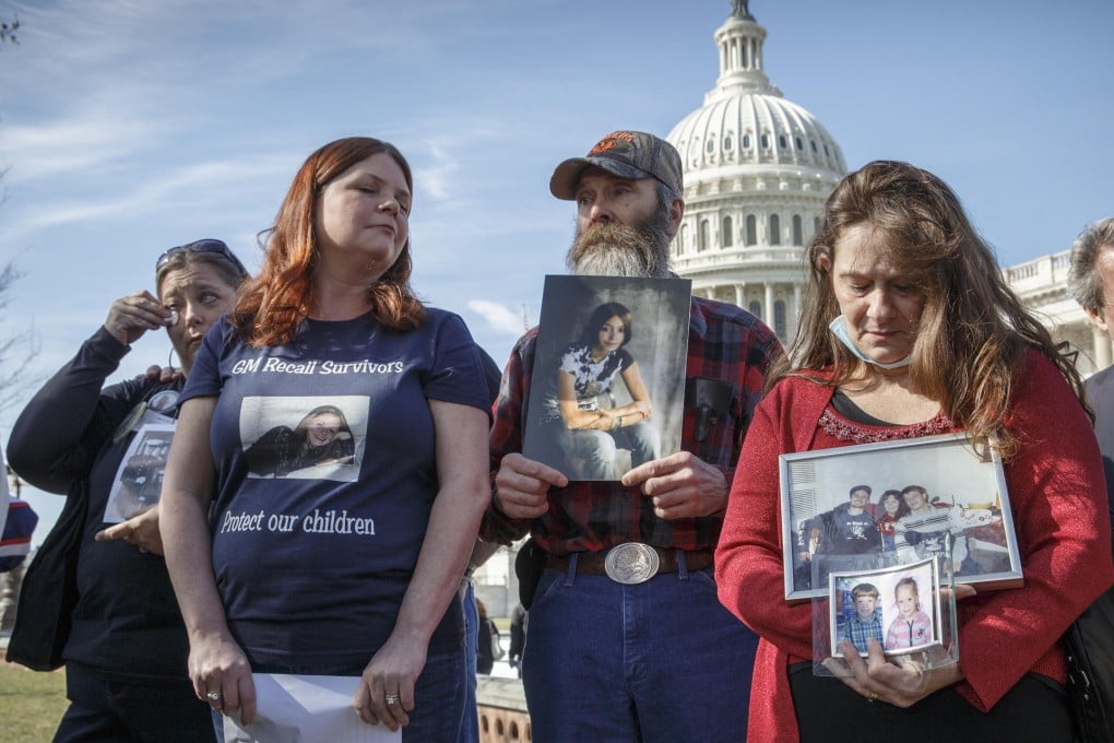 Parents hold pictures of their children who died in suspicious car crashes as they protest outside the US Capitol. Photo: AP