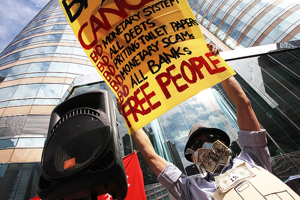 An "Occupy Central" protester demonstrates outside Exchange Square in 2011. Photo: Jonathan Wong