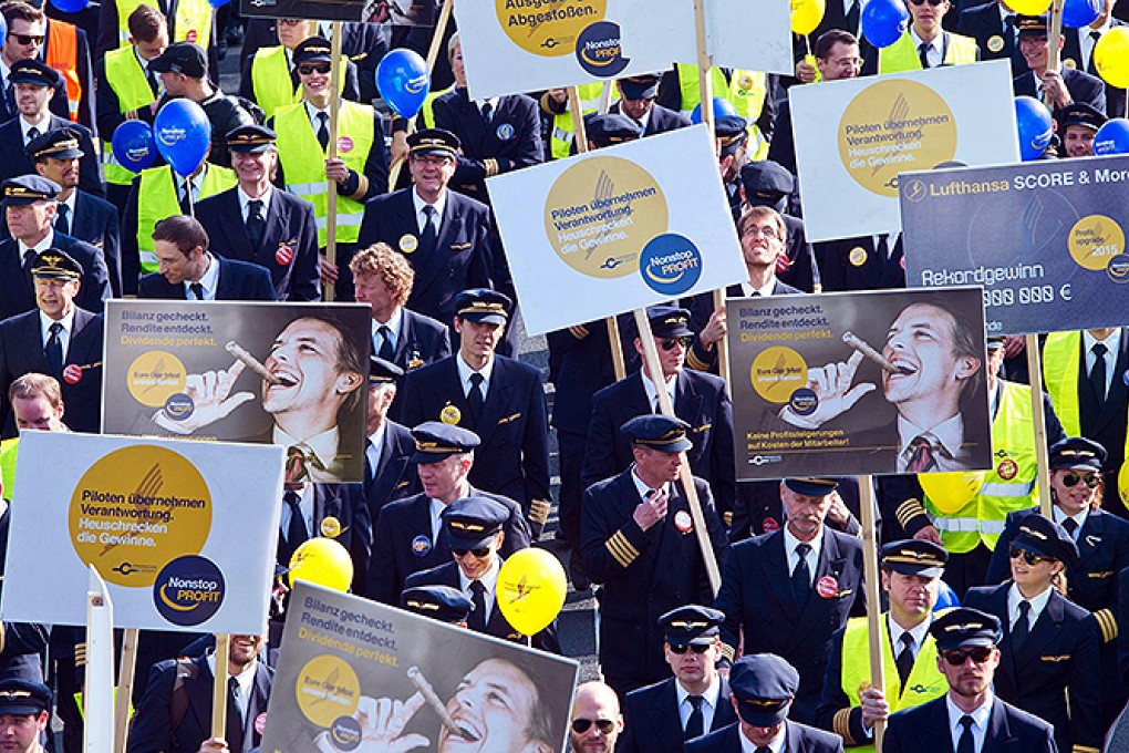 Striking pilots outside Frankfurt airport. The say the walkout is the only means to force management to compromise. Photo: EPA