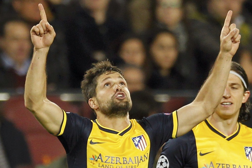 Diego Ribas celebrates his goal. Photo: Reuters