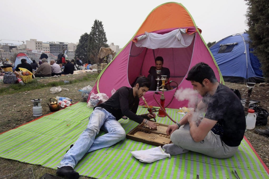 Backgammon is played in a Tehran park.Photo: AP