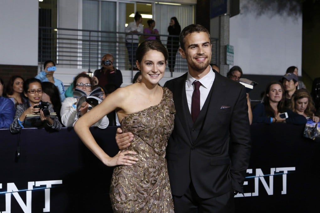 Cast members Shailene Woodley and Theo James pose at the premiere of "Divergent" in Los Angeles, California, March 18, 2014.  Photo: Reuters