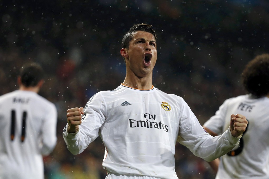 Cristiano Ronaldo celebrates his record-equalling strike. Photo: Reuters