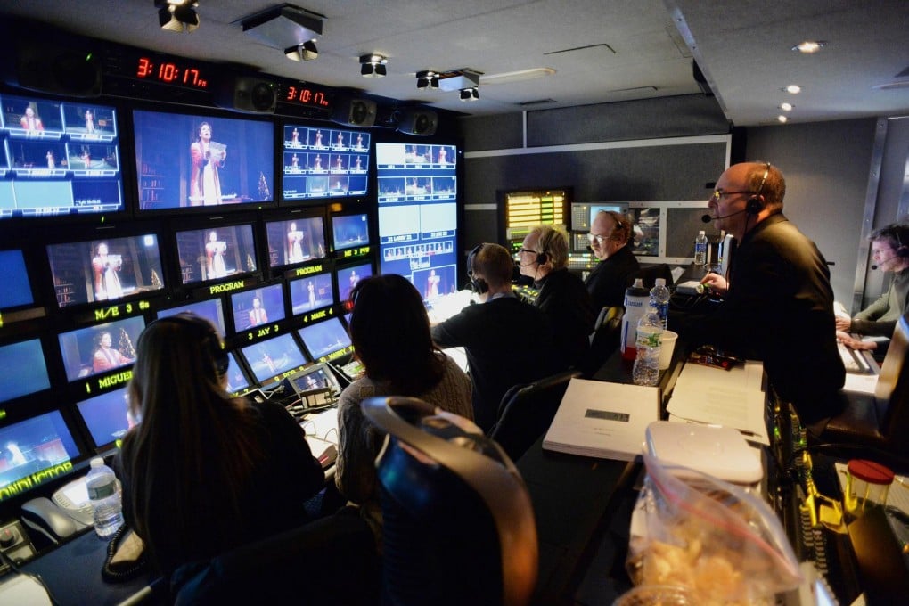 The Met's general manager Peter Gelb directs the live HD broadcast of Werther from a truck outside the opera house. Photo: AFP