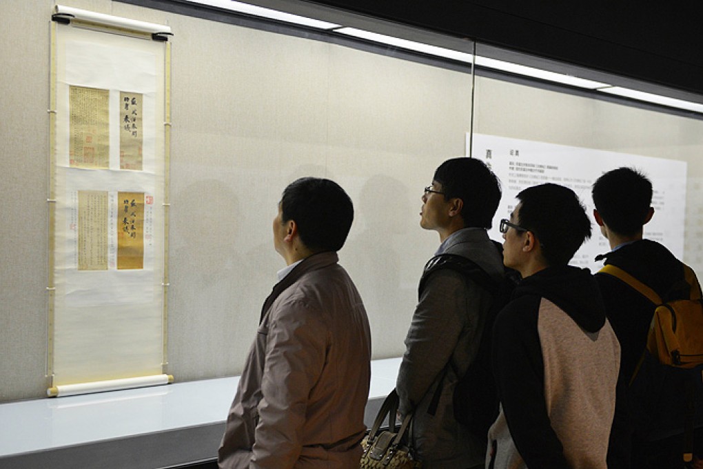 Visitors to the newly-opened Long Museum West Bund in Shanghai look at the ancient scroll that cost museum owner Liu Yiqian US$8.2 million. Photo: AFP