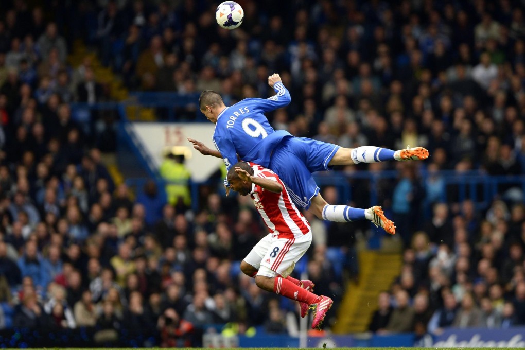 Chelsea's Fernando Torres challenges Stoke City's Wilson Palacios at Stamford Bridge. Photo: Reuters