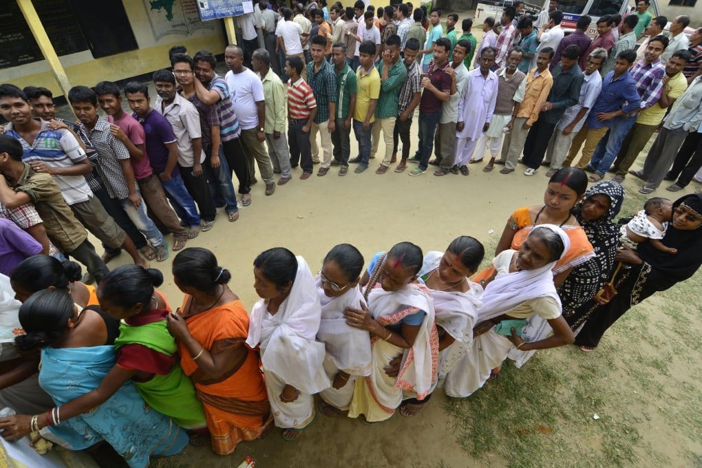 Indian villagers such as these queuing to vote still make up much of the electorate, but the balance is shifting towards electronically connected urbanites. Photo: EPA