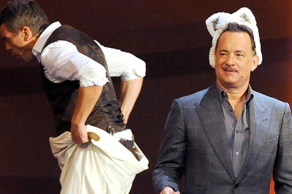 Tom Hanks watches a sack race on Wetten, dass? Photo: AFP