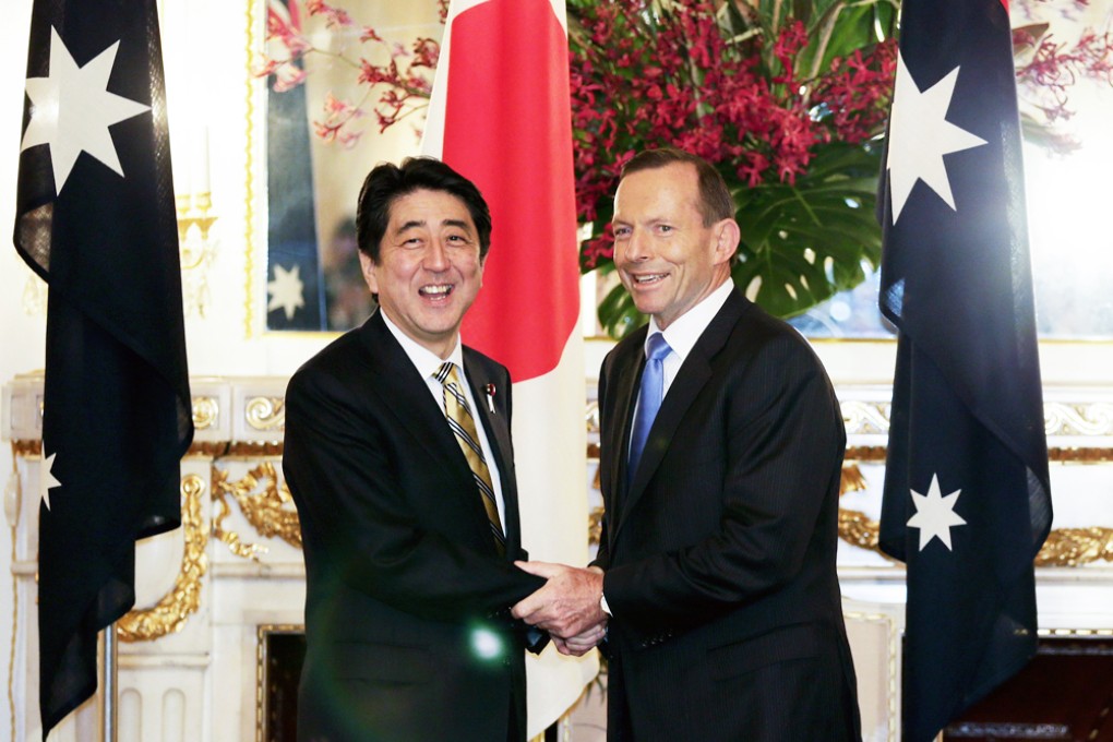 Australia's Prime Minister Tony Abbott (right) shakes hands with Japan's Prime Minister Shinzo Abe at the start of summit talks at the state guest house in Tokyo. Photo: Reuters