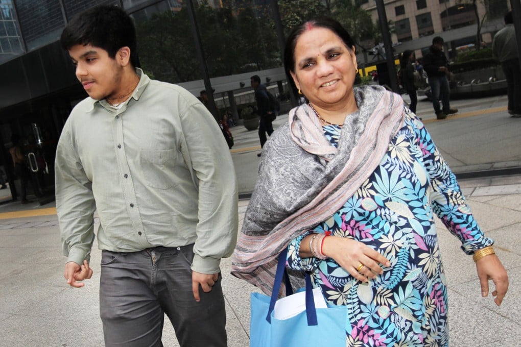 Arjun Singh and his mother, Anita Singh, walk out of the District Court in Wan Chai. Photo: Dickson Lee