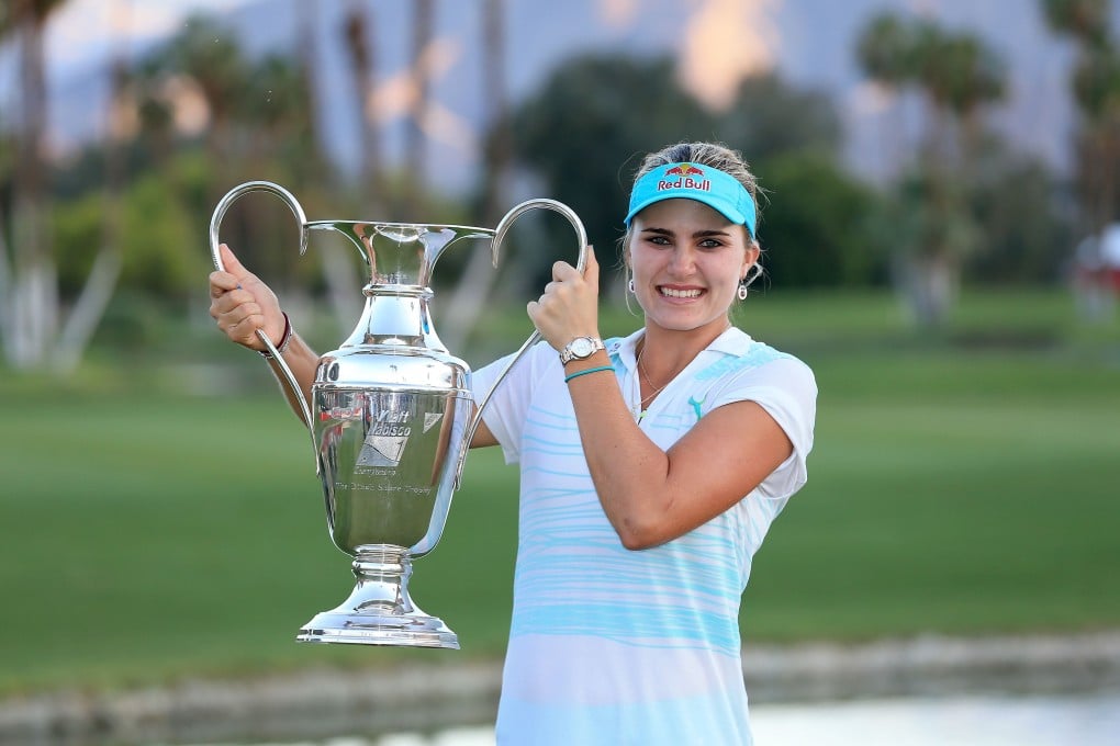 Lexi Thompson celebrates with the trophy. Photo: AFP