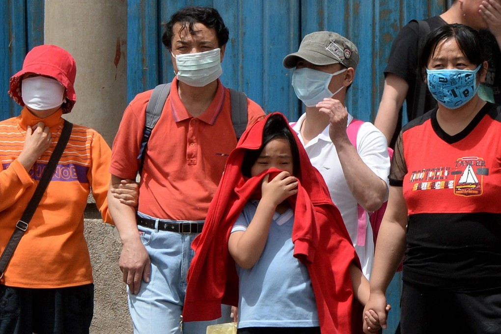 Masks are an increasingly common accessory in smoggy Beijing, as air pollution worsens. Photo: AFP