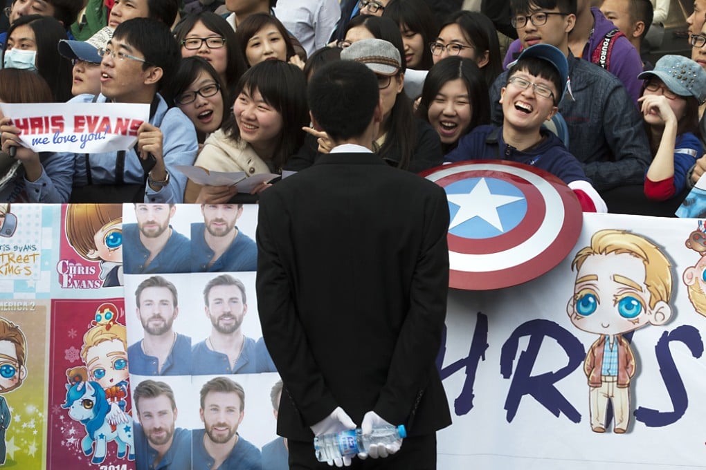 Fans wait for the arrival of Chris Evans, the actor playing Captain America, at a publicity event in Beijing. Photo: AP