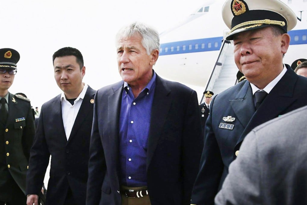 US defence chief Chuck Hagel is greeted by military personnel as he arrives at Qingdao airport before his inspection of China's first aircraft carrier, the Liaoning. Photo: AP