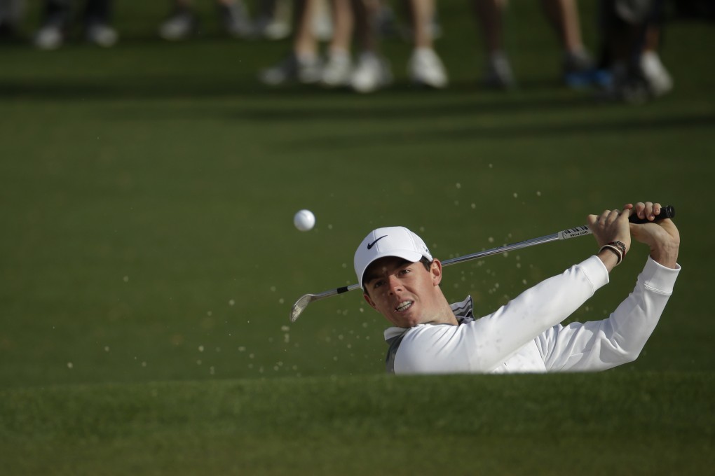 McIlroy hits on to the green at the second hole during a practice round at Augusta National on Tuesday. Photo: AP