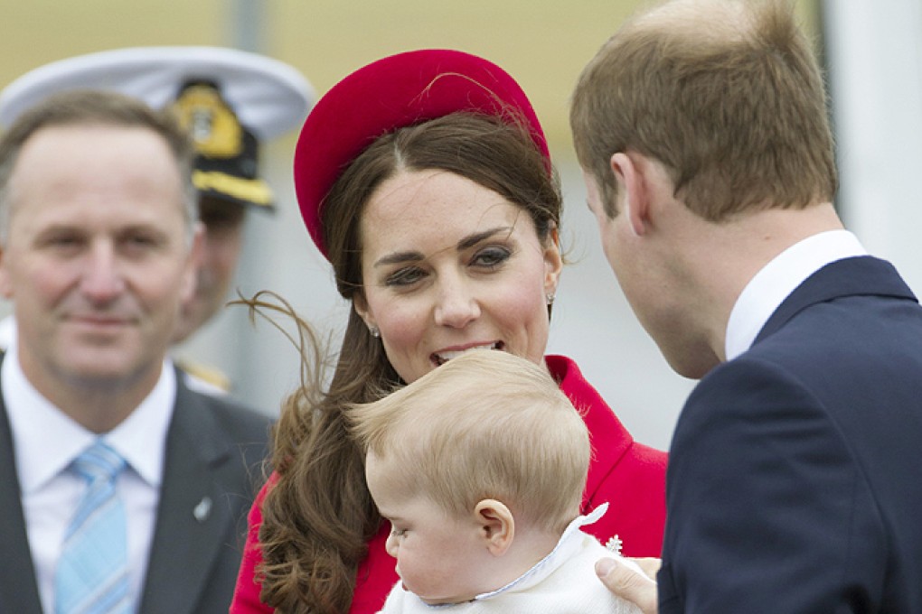 Prime Minister John Key (left) watches as Britain's Prince William, wife Catherine, and son Prince George arrive for their visit to New Zealand. Photo: AP