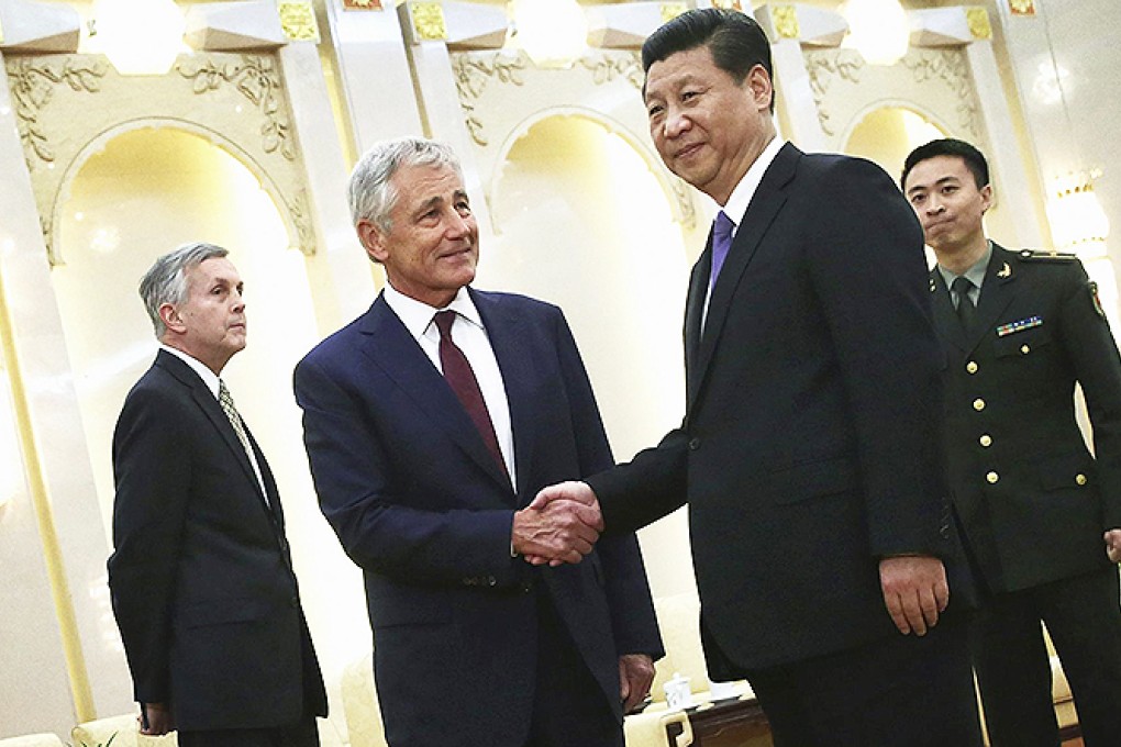 Xi Jinping greets Chuck Hagel at the Great Hall of the People. Photo: Reuters