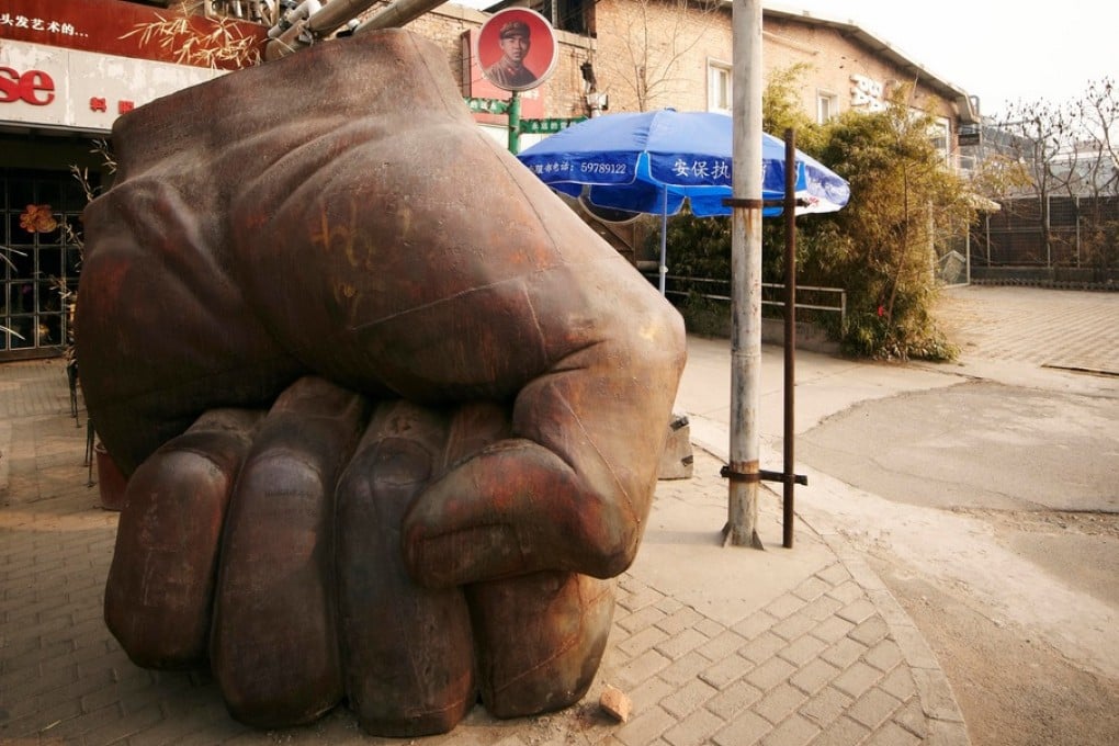 Liu Bolin's Iron Fist; a shop at 798 Art Zone. Photos: Zachary Bako