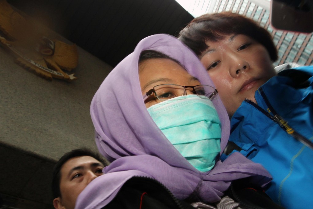 Erwiana leaves the consulate yesterday. She is in Hong Kong to testify against her ex-employer, who is accused of torture. Photo: Felix Wong