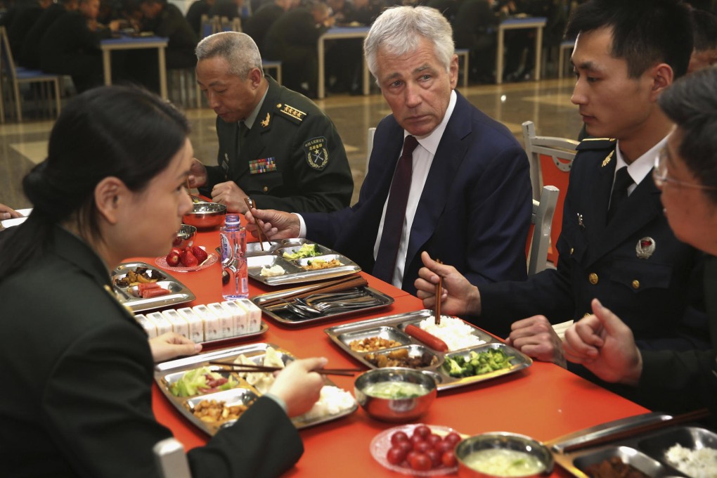 US Defence Secretary Chuck Hagel has lunch with officers and recruits at a PLA training academy yesterday. Photo: AP