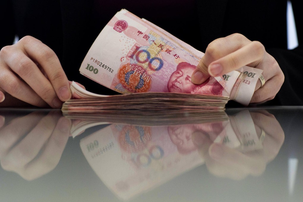 Hong Kong's yuan deposits swelled to 920.3 billion yuan at the end of February. Retail investors are seen as remaining optimistic about the currency. Photo: Bloomberg