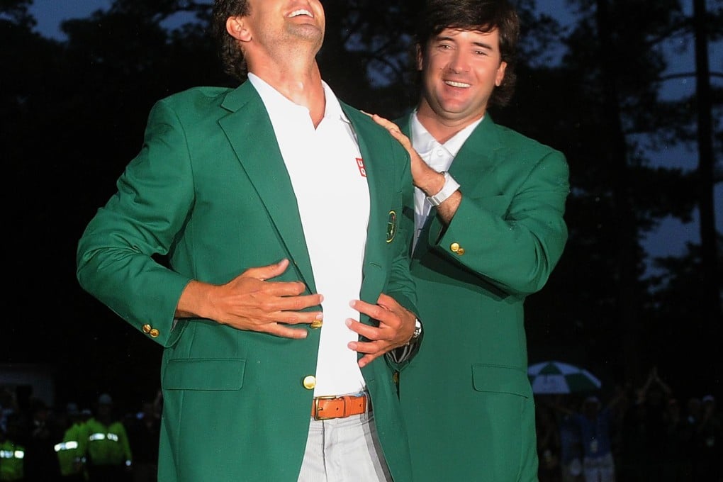 Bubba Watson (right) presents Adam Scott of Australia a green jacket at 77th Masters tournament at Augusta National Golf Club last year. Photo: AFP