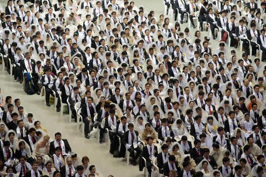 A mass wedding organised by the Unification Church. Foreign spouses struggle to assimilate in the ethnically homogenous society. Photo: AFP