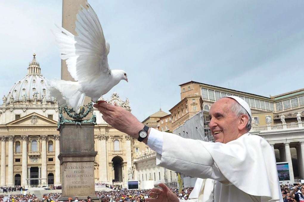 Pope Francis releasing two doves during the weekly Wednesday general audience in St Peters Square, Vatican. Photo: EPA