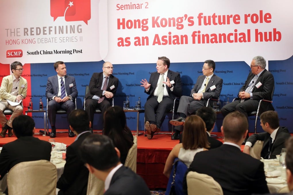 Post columnist George Chen (left) with the panel at yesterday's seminar discussing Hong Kong's role as a financial hub. Photo: K.Y. Cheng