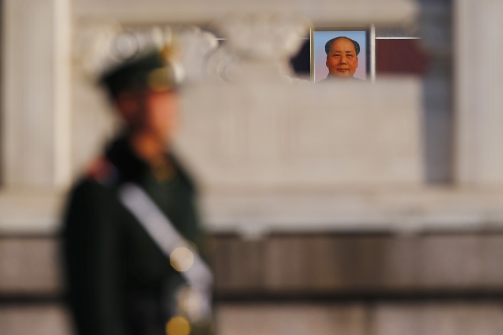 A paramilitary policeman stands guard in Tiananmen Square. Photo: Reuters