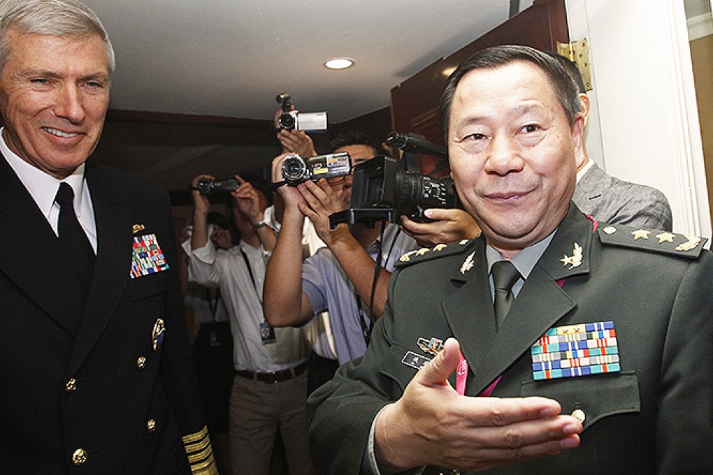 ieutenant General Qi Jianguo welcomes US Navy Admiral Samuel Locklear to a sidelines meeting at the Singapore forum. Photo: Reuters