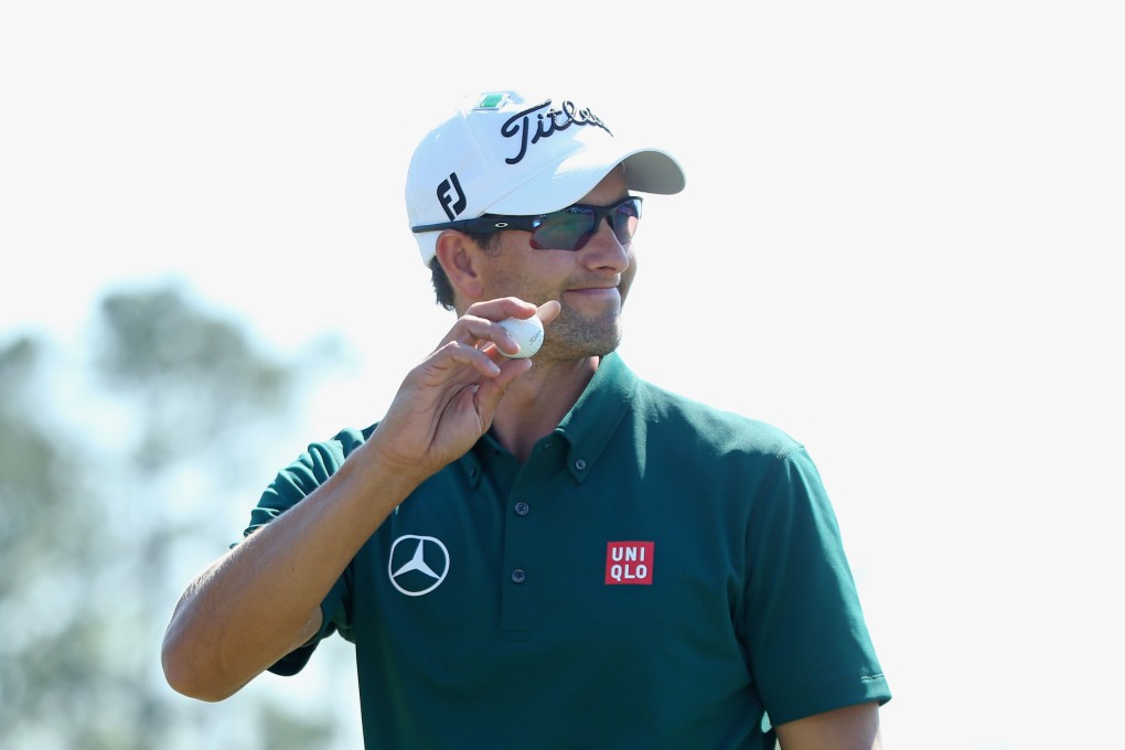 Defending champ Adam Scott smiles at the fans. Photo: AFP