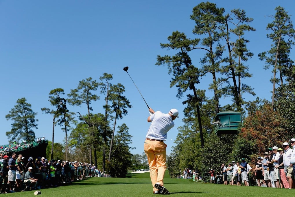 Bill Haas of the United States hits his tee shot on the 18th hole. Photo: AFP