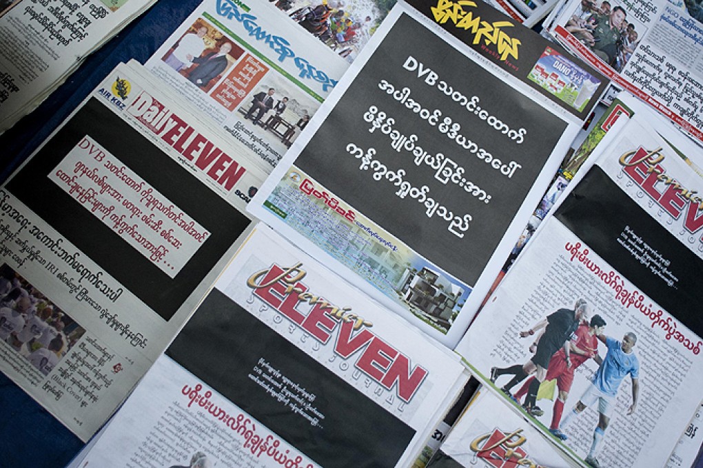 Newspapers with a black front page at a stall in Yangon on Friday after Zaw Pe, a journalist for the Democratic Voice of Burma, was convicted of trespassing and "disturbing a civil servant". Photo: AFP