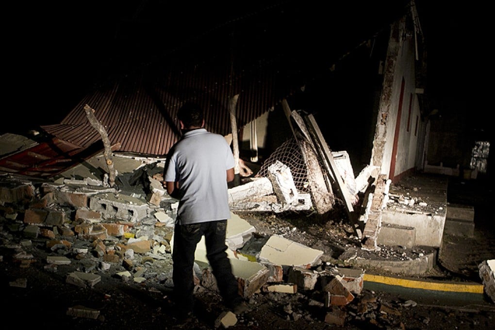 A resident in front of a home that was damaged by an earthquake in Nagarote, Nicaragua, late on Thursday. Photo: AP