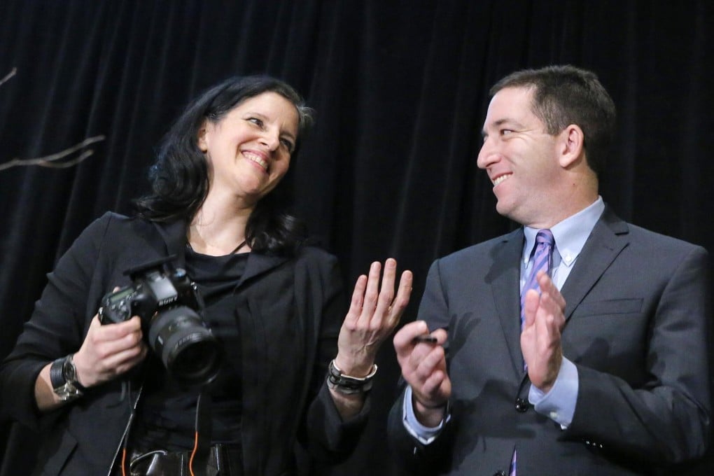 Laura Poitras and Glenn Greenwald receive an award for national security reporting for their stories on the spy programmes. Photo: Reuters