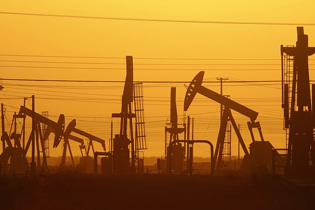 Pumps at dawn in an oil field over a formation where gas and oil extraction using hydraulic fracturing, or 'fracking' is underway. Photo: AFP
