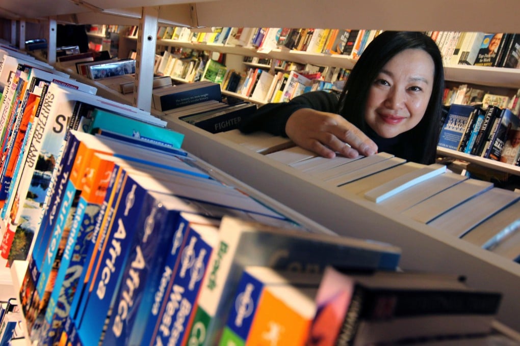 Jannie Tam of Dymocks Franchise Systems (China) says the city's readers still enjoy visiting bookshops and flipping through books despite the digital revolution. Photo: May Tse