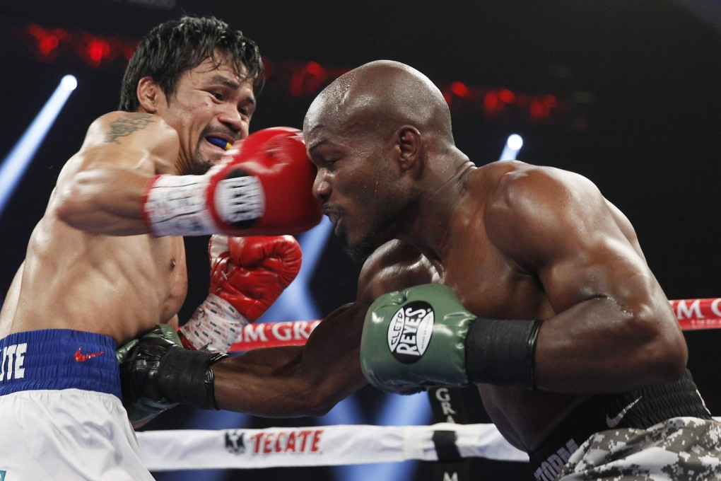 Manny Pacquiao hits Timothy Bradley with a right. Photo: Reuters