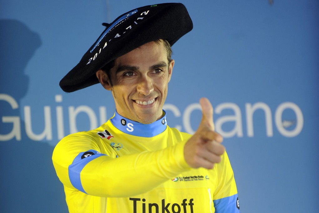 Alberto Contador celebrates his victory on the podium of the last stage of the Tour of the Basque Country in Markina, northern Spain. Photo: AFP