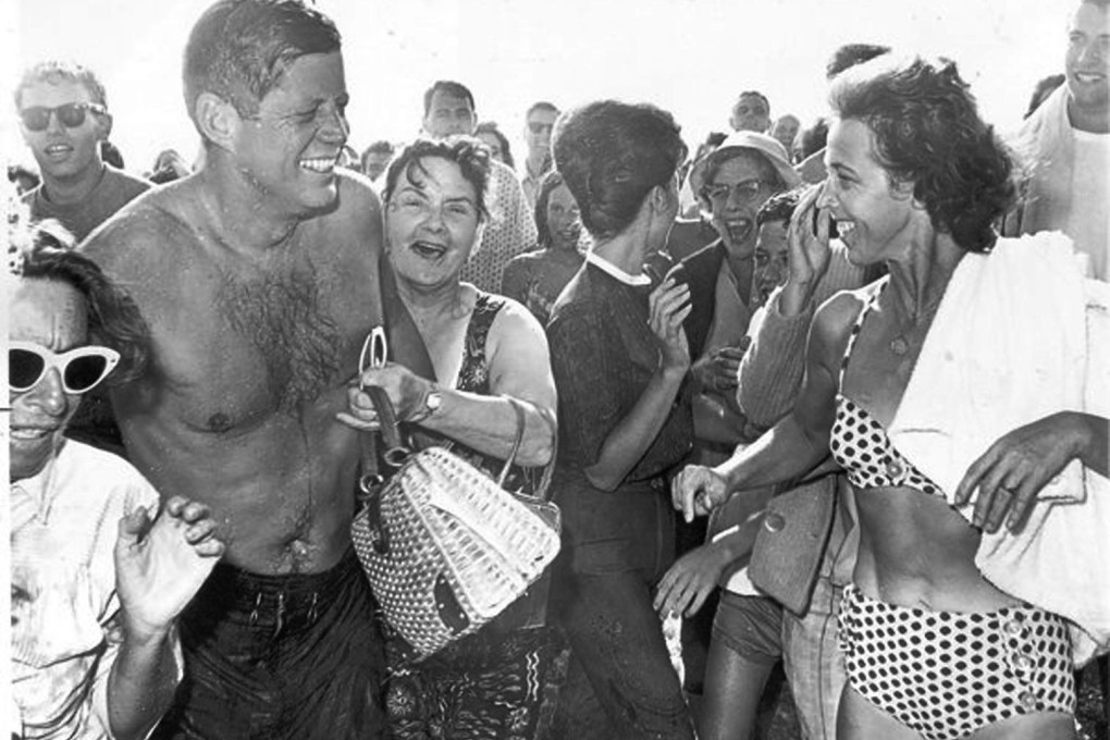 Eva Ban (right) laughs with JFK