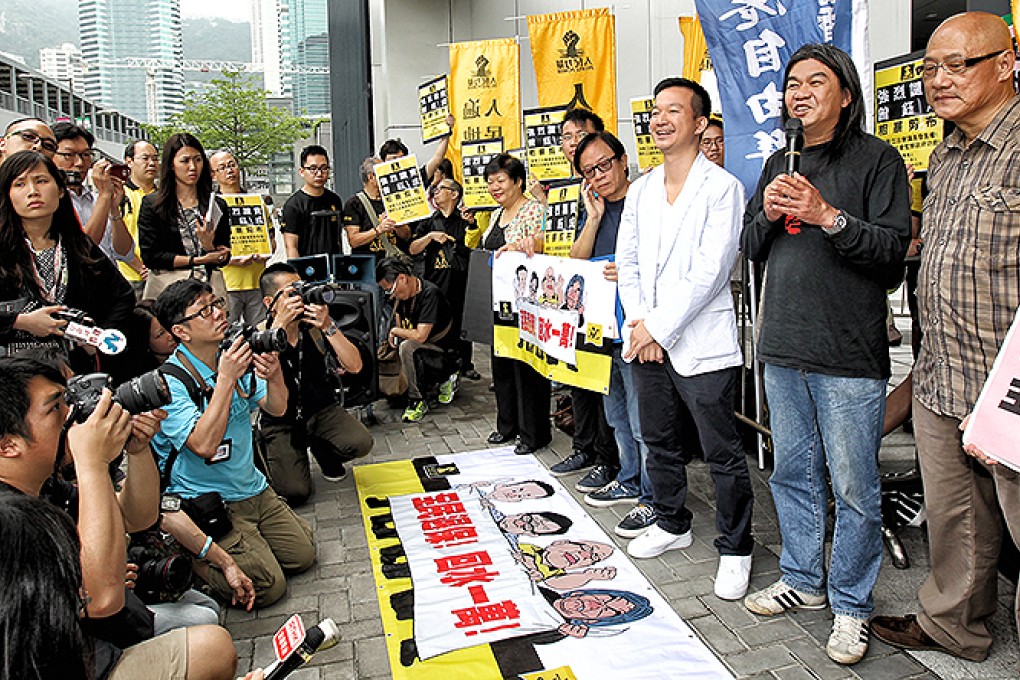 Lawmakers Raymond Chan Chi-chuen, Leung Kwok-hung and Albert Chan Wai-yip and members of People Power and League of Social Democrats protest outside Legislative Council in Tamar after council president Jasper Tsang Yok-sing decided to end the filibuster on the debate of the budget in 2013. Photo: Dickson Lee