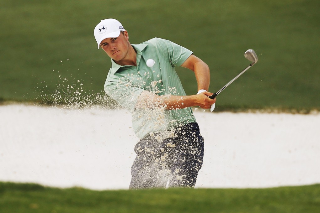 Jordan Spieth hits from the sand trap on the tenth hole. Photo: Reuters