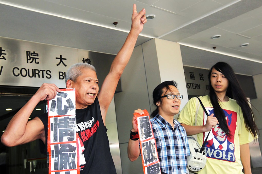 Hong Kong activist Yang Kuang (centre) spoke out for human rights when he was put on trial yesterday. Photo: Dickson Lee
