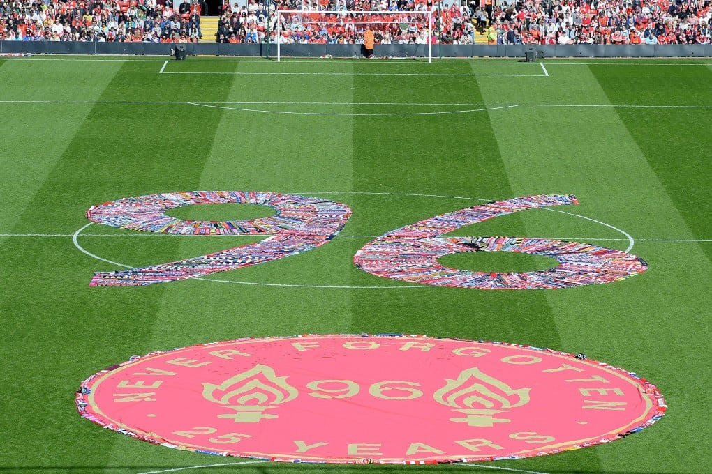 The figure 96, made up of fans' scarves, fills the centre circle before Tuesday's memorial service at Anfield. Photo: AP