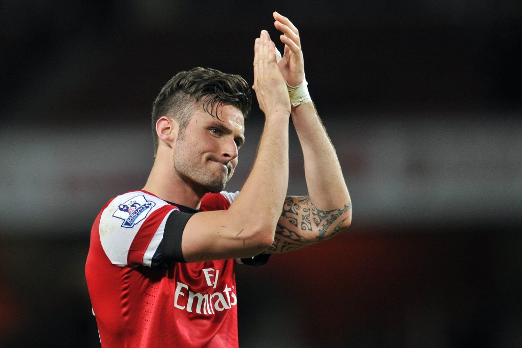 Arsenal's French striker Olivier Giroud thanks the fans after the final whistle. Photo: AFP
