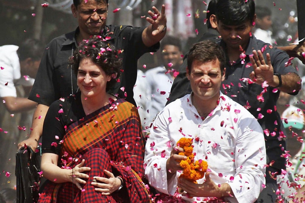 Rahul Gandhi (right) and his sister Priyanka Gandhi Vadra are showered with rose petals by their supporters upon Rahul's arrival to file his nomination for the general election at Amethi, northern Indian state of Uttar Pradesh. Photo: Reuters