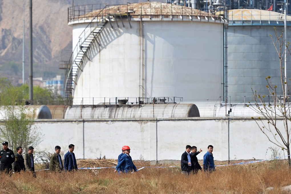 Investigators work at the spot of accident in Lanzhou, Gansu. Photo: Xinhua