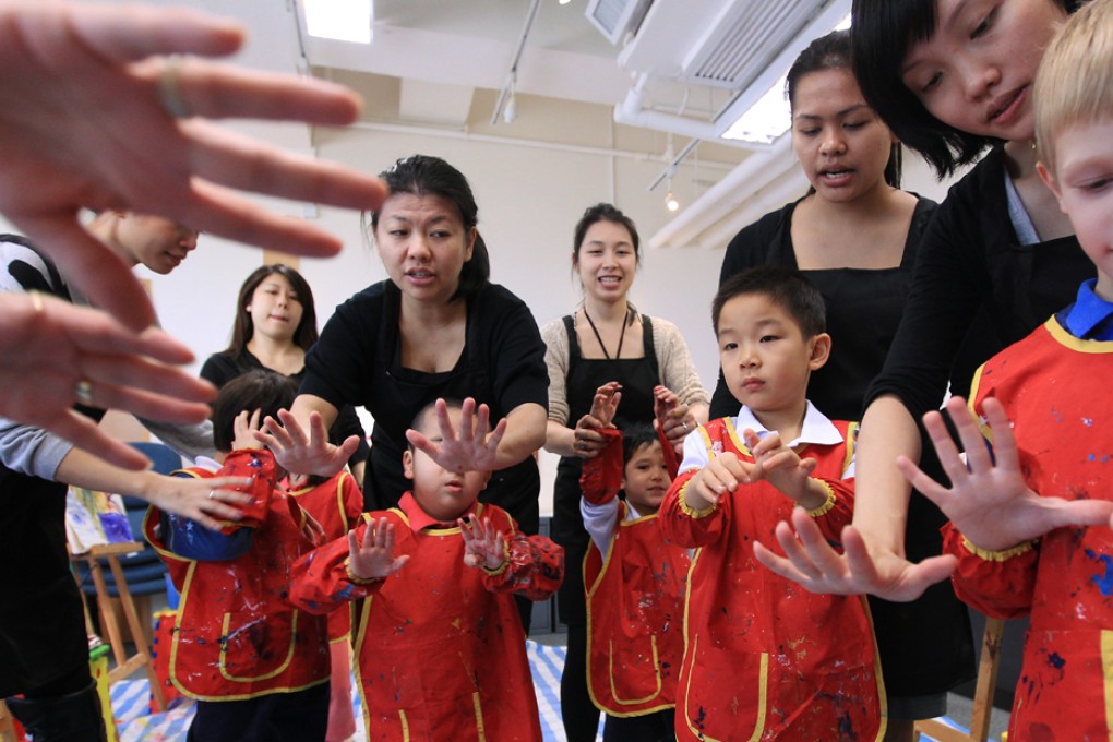 Autistic children are enjoying a combination of music and painting at classes. The art lessons have been hailed for their impact on the children's social skills. Photo: Jonathan Wong